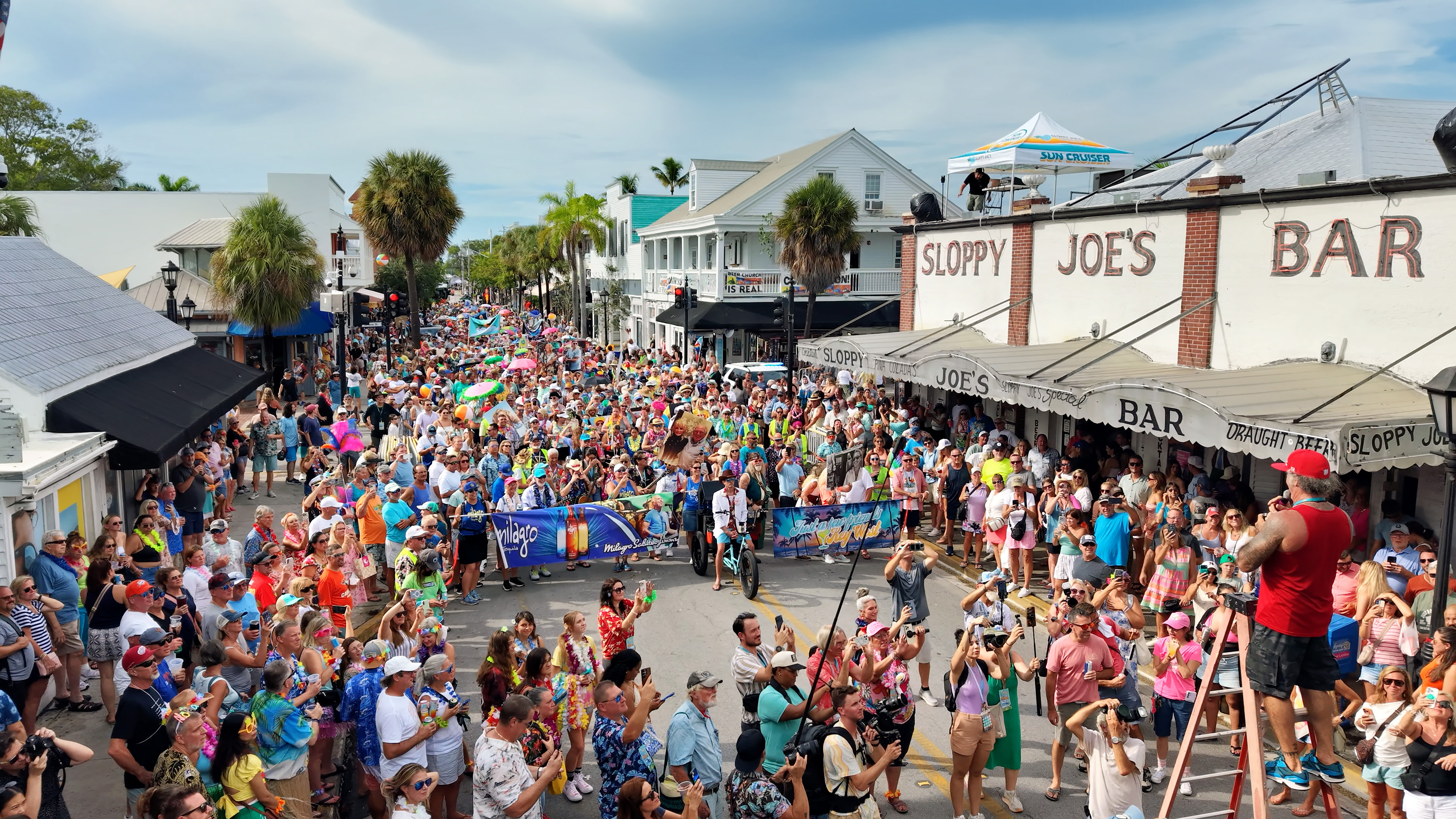 Paul Menta leads Jimmy Buffett fans in a toast outside Sloppy Joe’s Bar in Key West on September 6, 2026.