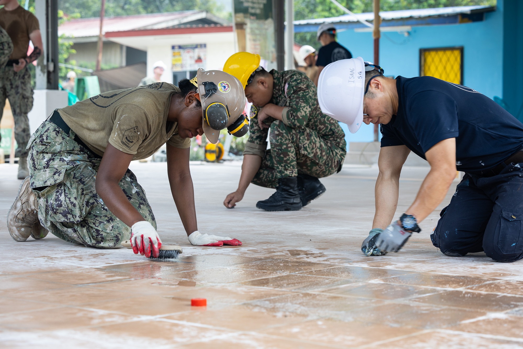 Malaysian and visiting engineers work at Babagon Toki Primary School during Pacific Partnership 2026.