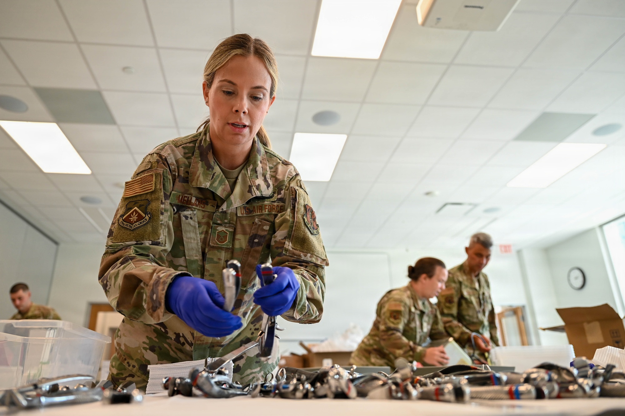 Master Sgt. Joeleen Mellars organizes dental instruments at the August 1, 2026 GuardCare clinic.