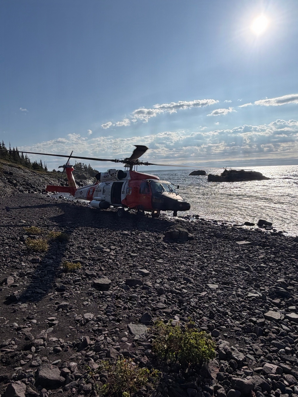 A Coast Guard helicopter on the shore of Isle Royale during the September 11 search operation.