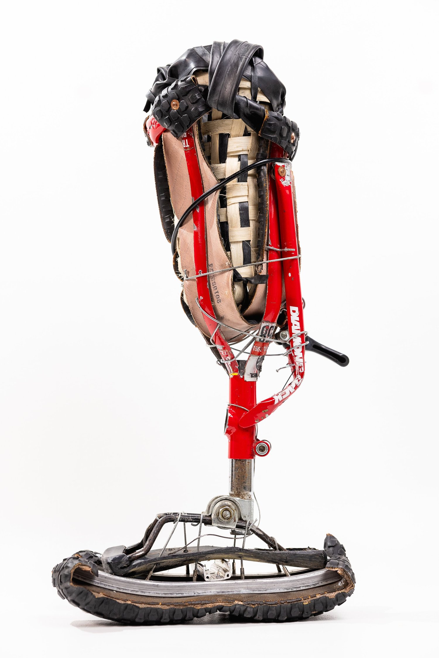 A Project Bike Leg prosthesis assembled from bicycle components, photographed separately from the walking footage.