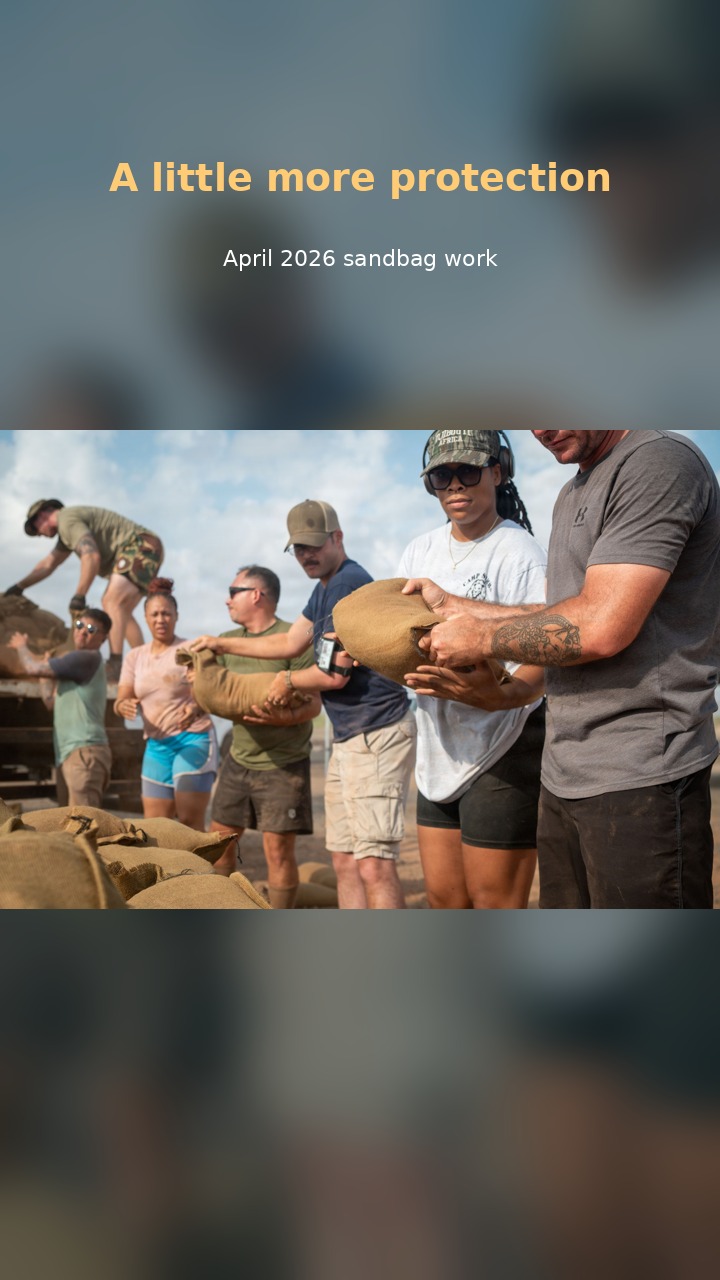 Friends of Africa Volunteers help protect Caritas facilities with hands-on sandbag work.